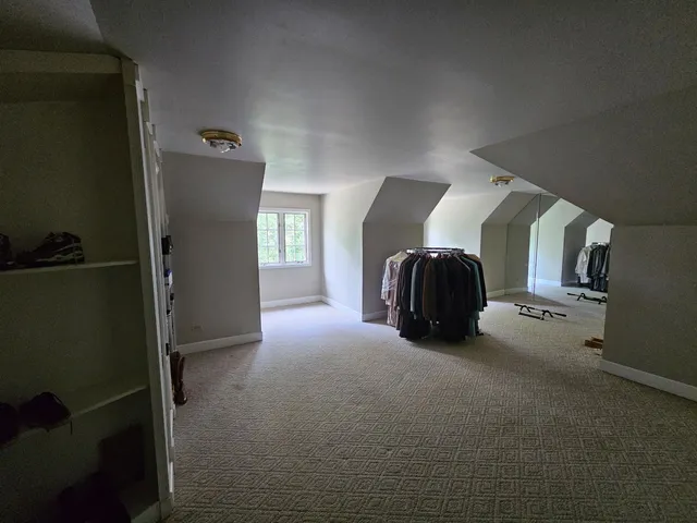 a room with a walk in closet and window