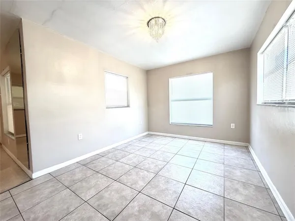 a view of an empty room with a window