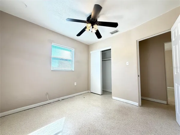 a view of room with ceiling fan