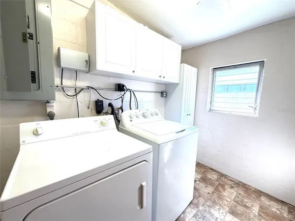 a utility room with dryer and washer
