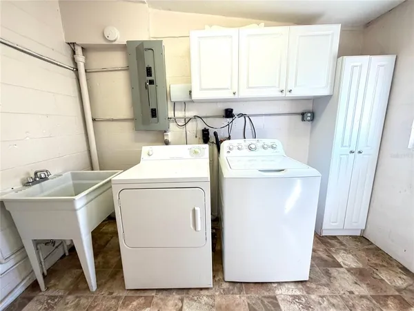 a utility room with dryer and washer