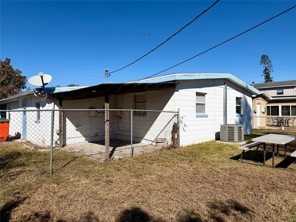 a house with trees in the background