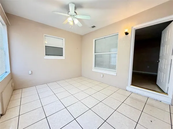 a view of an empty room with a bathroom
