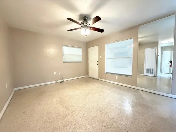 a view of an empty room with a window