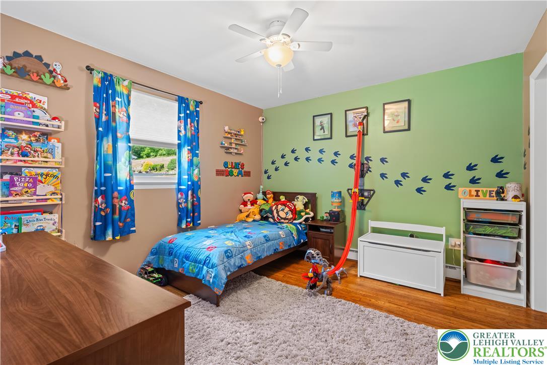 50 Kohls Road Northampton, PA 18067 - Photo 18 of 54 Hardwood floors and ample natural light enhance this spacious, cozy bedroom.