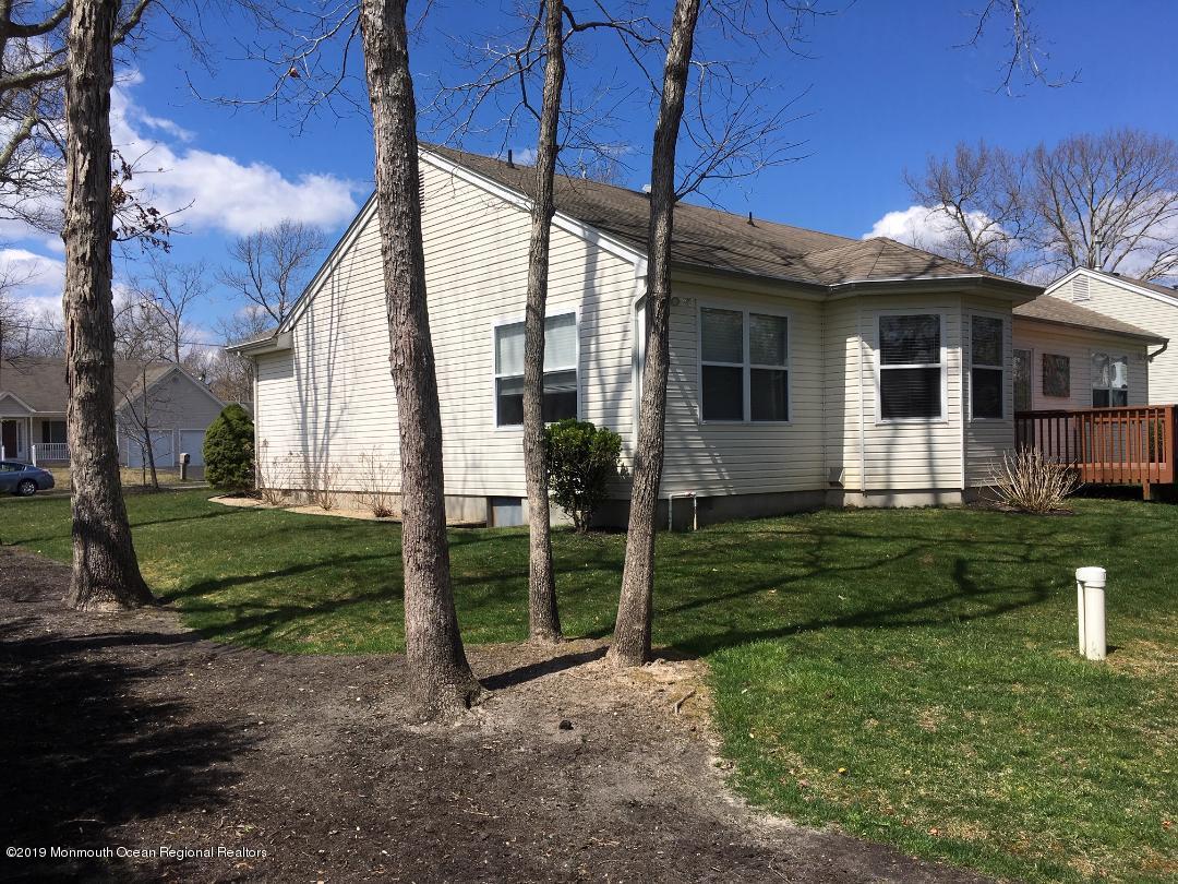 101 Bark Road Manahawkin, NJ 08050 - Photo 23 of 25 a view of a house with backyard and garden