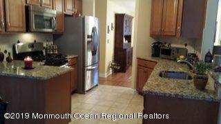 101 Bark Road Manahawkin, NJ 08050 - Photo 5 of 25 a kitchen with stainless steel appliances granite countertop a refrigerator a stove and a sink