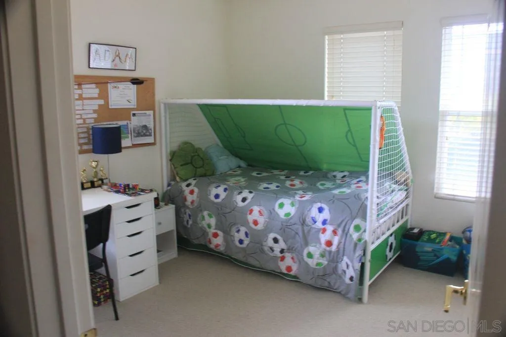 1467 Beechtree Road San Marcos, CA 92078 - Photo 3 of 8 a bedroom with a bed and a window