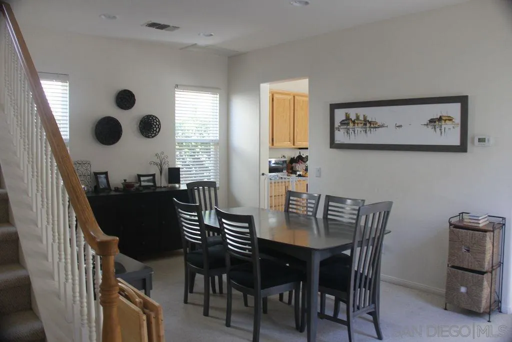 1467 Beechtree Road San Marcos, CA 92078 - Photo 6 of 8 a view of a dining room with furniture and chandelier