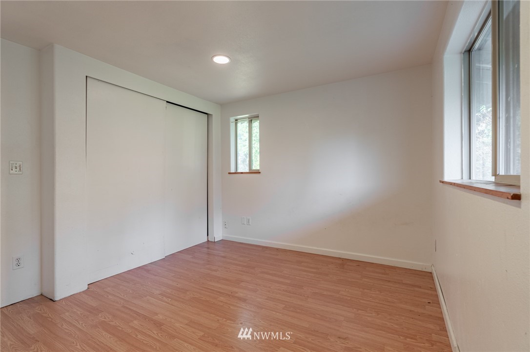7370 Enterprise Road Ferndale, WA 98248 - Photo 22 of 25 a view of empty room with wooden floor and fan