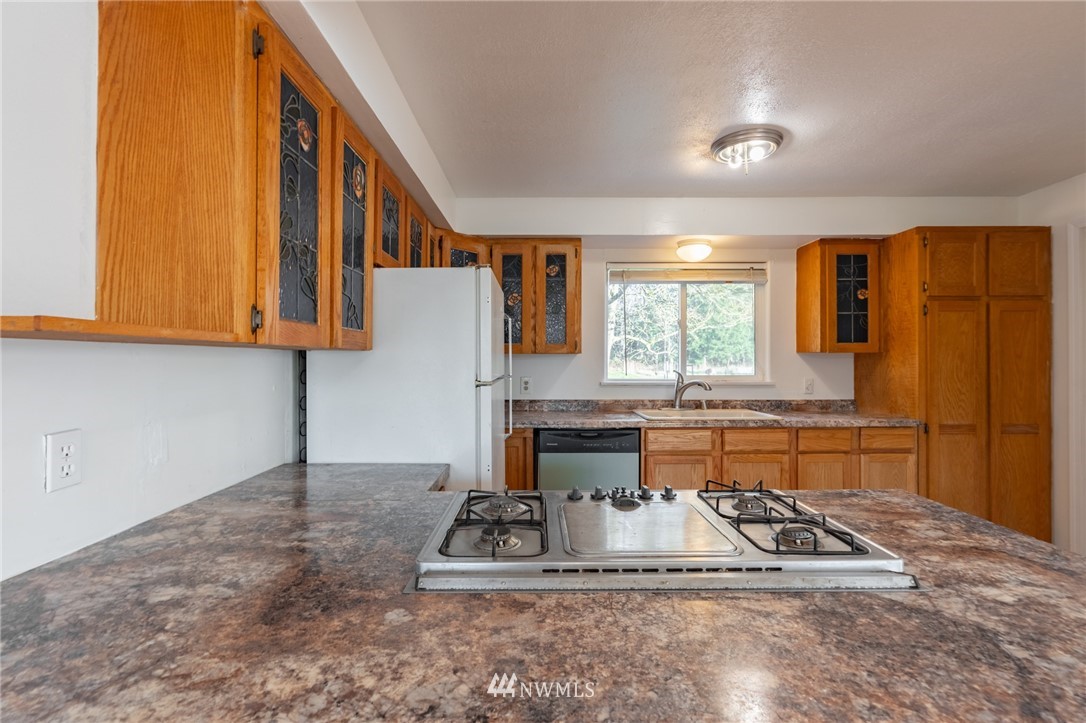 7370 Enterprise Road Ferndale, WA 98248 - Photo 6 of 25 a kitchen with sink refrigerator and window