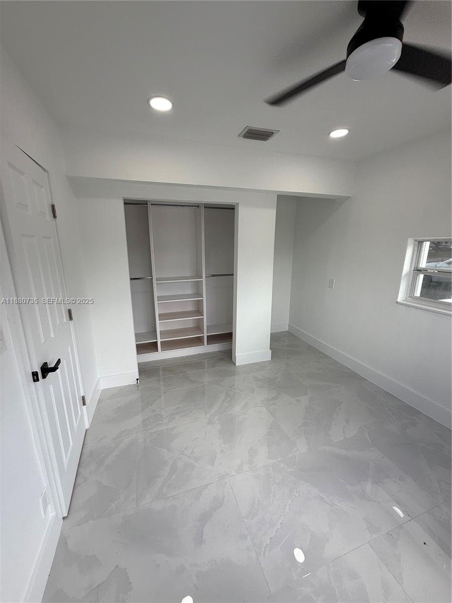 841 West 50th Street, Unit 2 Hialeah, FL 33012 - Photo 4 of 12 wooden floor in an empty room