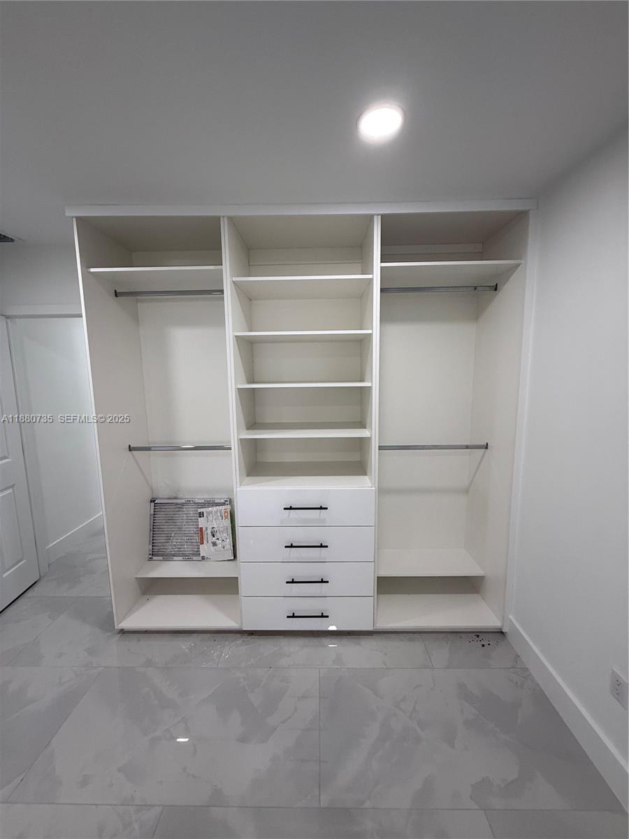 841 West 50th Street, Unit 2 Hialeah, FL 33012 - Photo 6 of 12 a view of an empty walk in closet