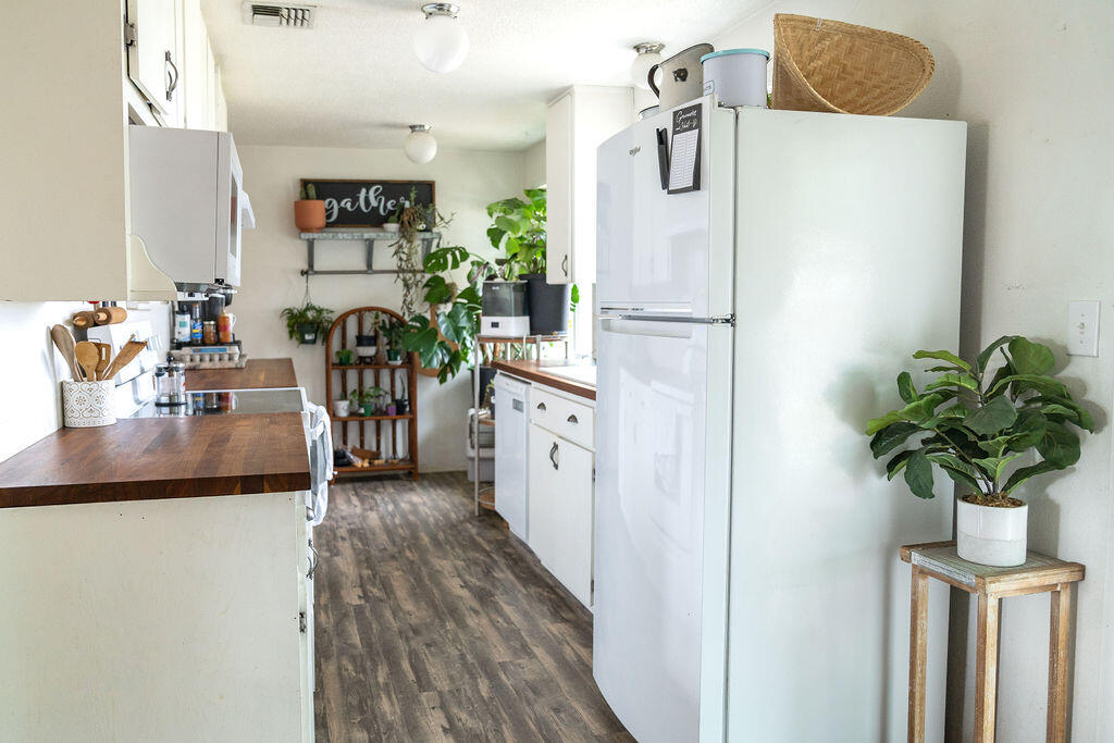 7865 Division Road White City, OR 97503 - Photo 7 of 18 a kitchen with sink refrigerator and stove