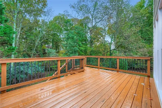 a view of a balcony with wooden floor