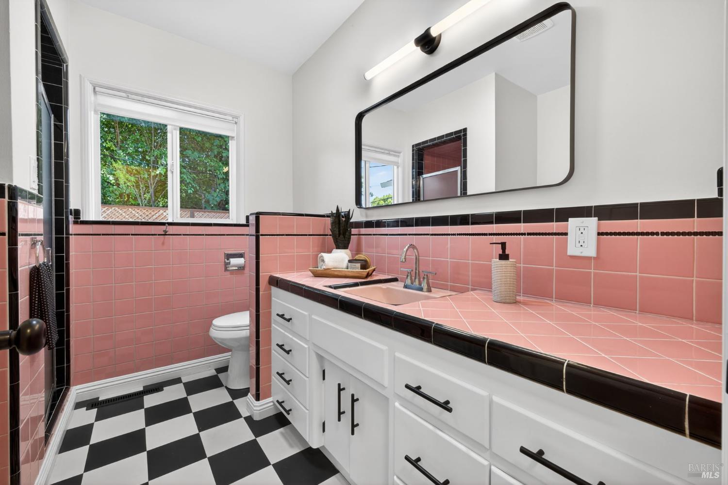 2211 Humboldt Street Santa Rosa, CA 95404 - Photo 33 of 52 a bathroom with a granite countertop sink and a mirror