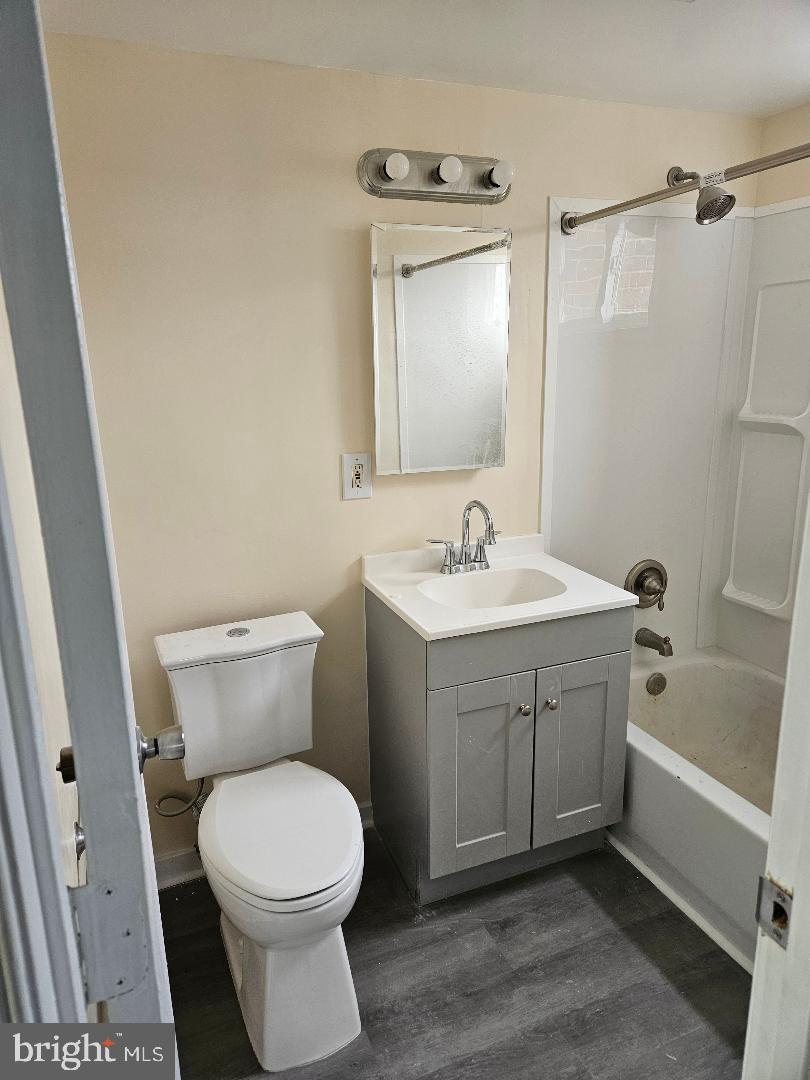 10 Halley Place Southeast, Unit 203 Washington, DC 20032 - Photo 3 of 13 a bathroom with a sink a toilet and shower