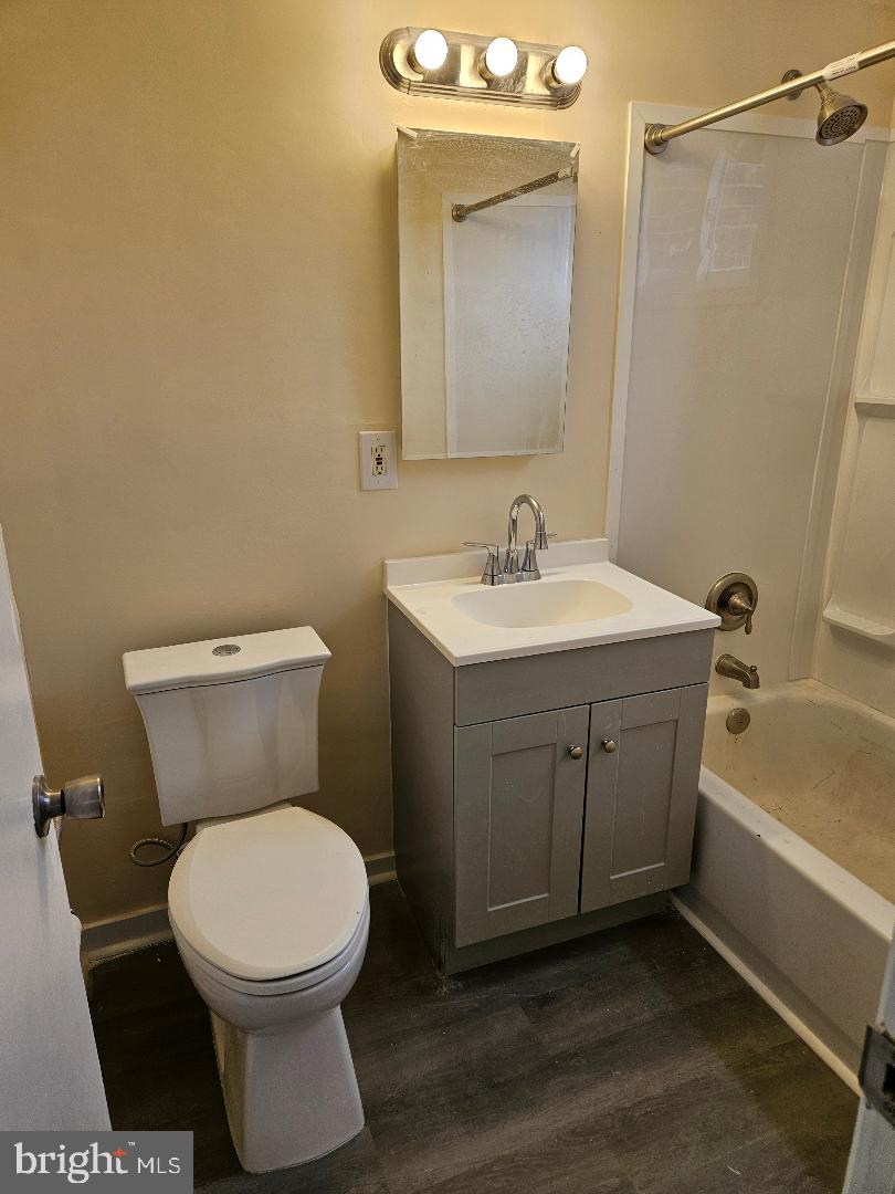 10 Halley Place Southeast, Unit 203 Washington, DC 20032 - Photo 4 of 13 a bathroom with a toilet a sink and bathtub