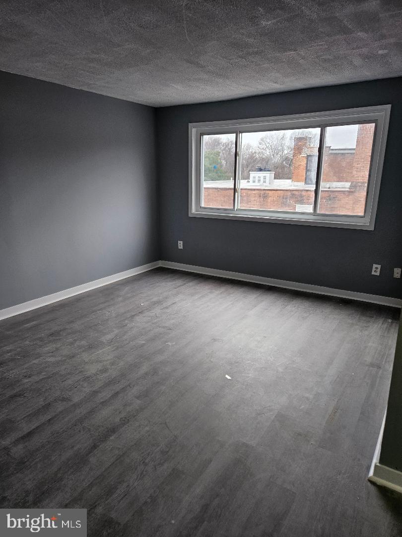 10 Halley Place Southeast, Unit 203 Washington, DC 20032 - Photo 5 of 13 an empty room with a window