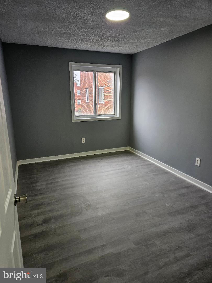 10 Halley Place Southeast, Unit 203 Washington, DC 20032 - Photo 7 of 13 an empty room with windows