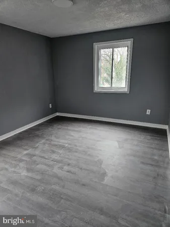 a kitchen with stainless steel appliances granite countertop a sink a stove and cabinets