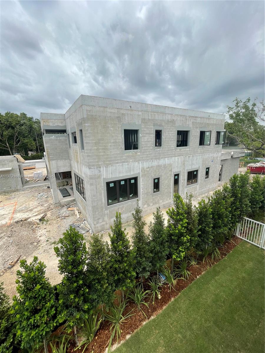 5286 Southwest 80th Street Miami, FL 33143 - Photo 3 of 12 a view of building with garden and trees in the background