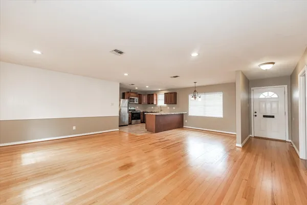 a view of kitchen and wooden floor