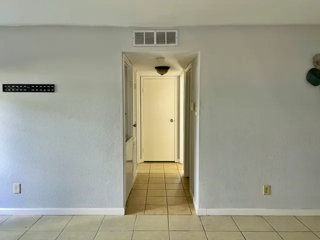 a view of a hallway with closet