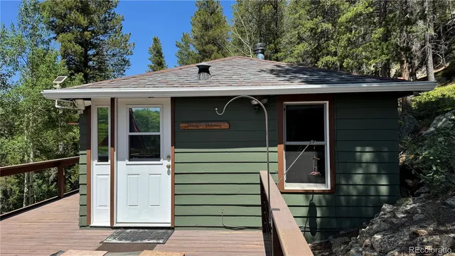 a view of a house with a door and wooden floor