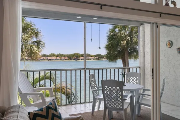 a view of a balcony with furniture