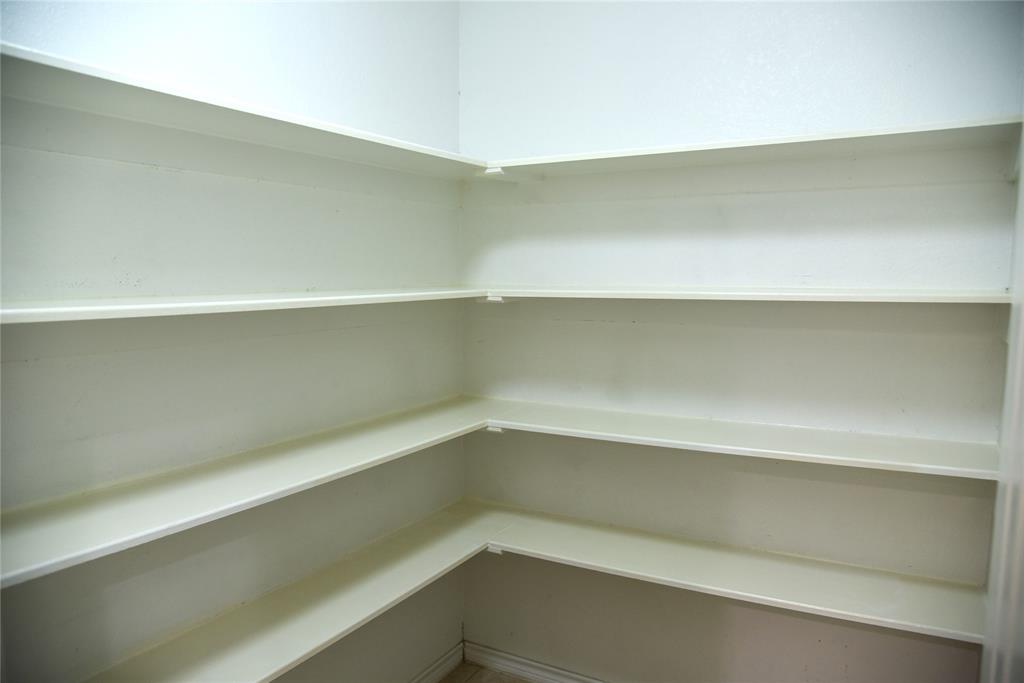 1526 Pebblestone Court Allen, TX 75002 - Photo 8 of 28 Built-in shelving providing extensive storage