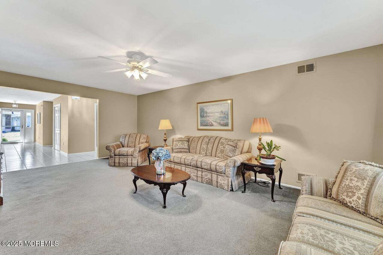 72 Jean Street Lakewood, NJ 08701 - Photo 12 of 34 a living room with furniture and a potted plant