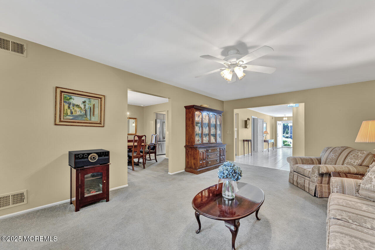 72 Jean Street Lakewood, NJ 08701 - Photo 13 of 34 a living room with furniture and a flat screen tv