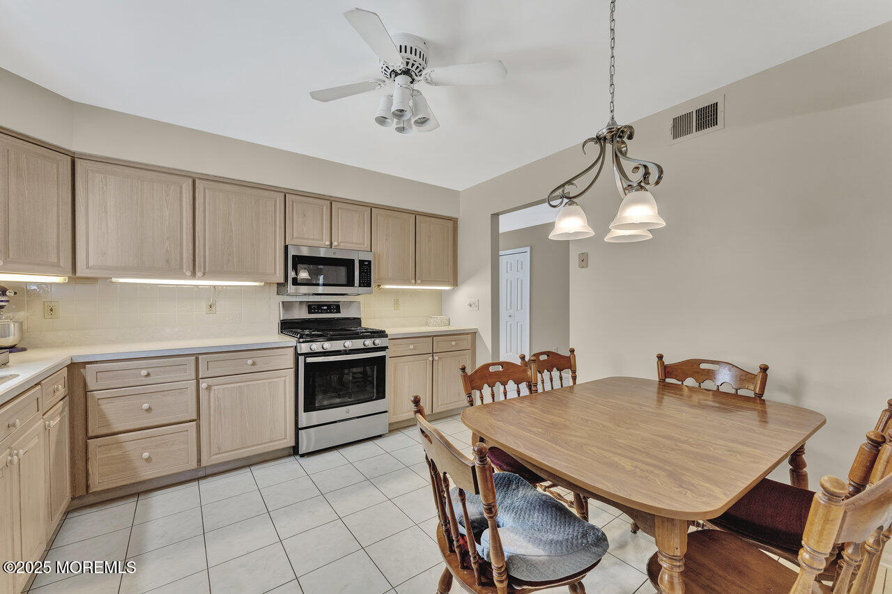 72 Jean Street Lakewood, NJ 08701 - Photo 16 of 34 a kitchen with cabinets a sink and appliances