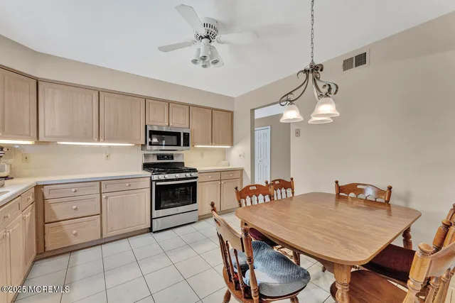 a kitchen with cabinets a sink and appliances