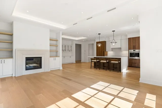 a kitchen with furniture and a fireplace