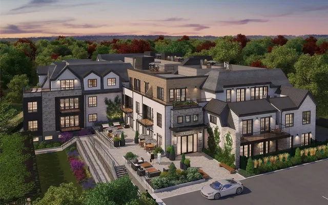 a aerial view of multiple houses with a yard