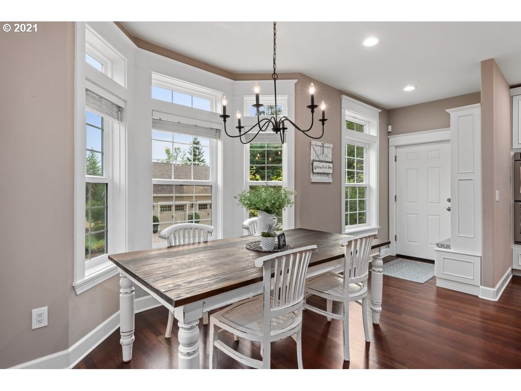 21892 South Ferguson Road Beavercreek, OR 97004 - Photo 11 of 32 a view of a dining room with furniture window and wooden floor