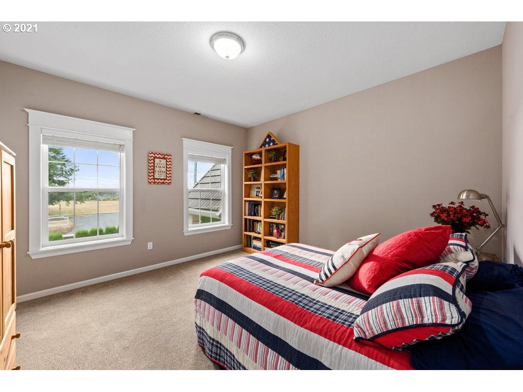 21892 South Ferguson Road Beavercreek, OR 97004 - Photo 26 of 32 a bedroom with a bed and a window