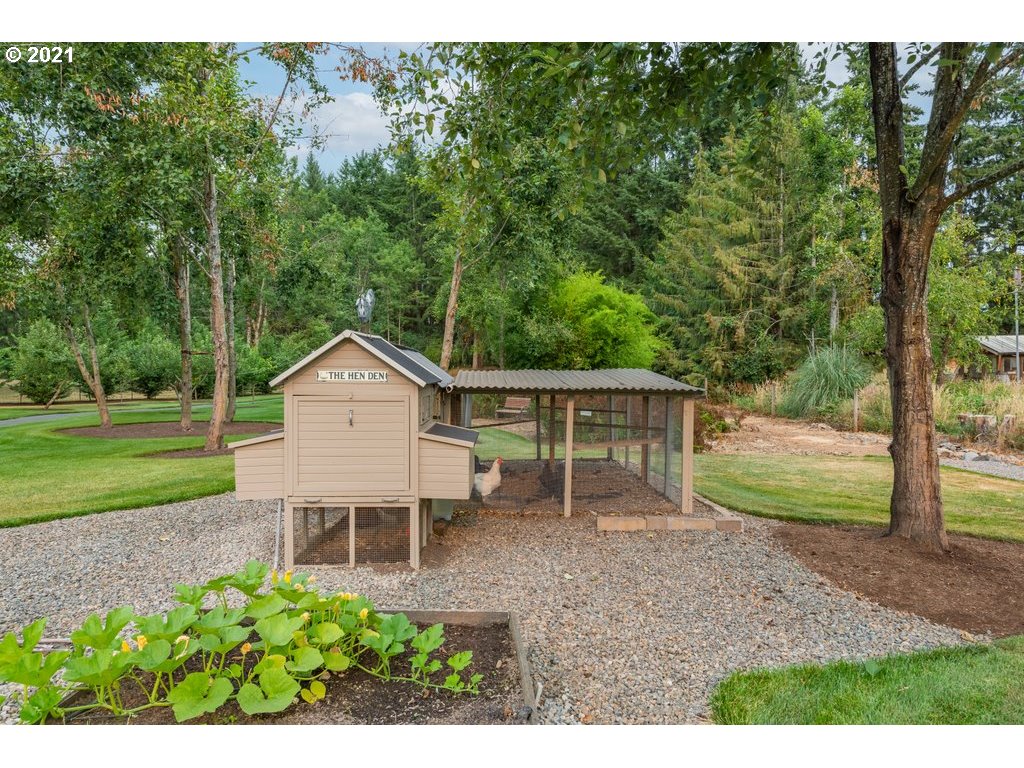 21892 South Ferguson Road Beavercreek, OR 97004 - Photo 30 of 32 a view of a house with backyard and a tree