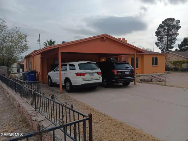 a view of a car parked in front of a house