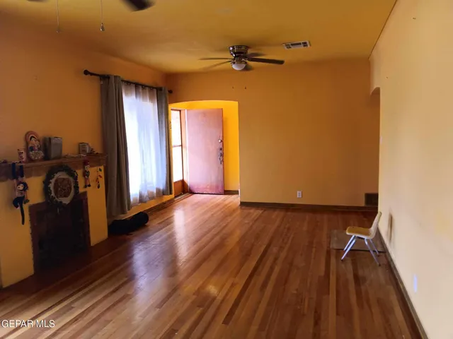 a view of a livingroom with wooden floor