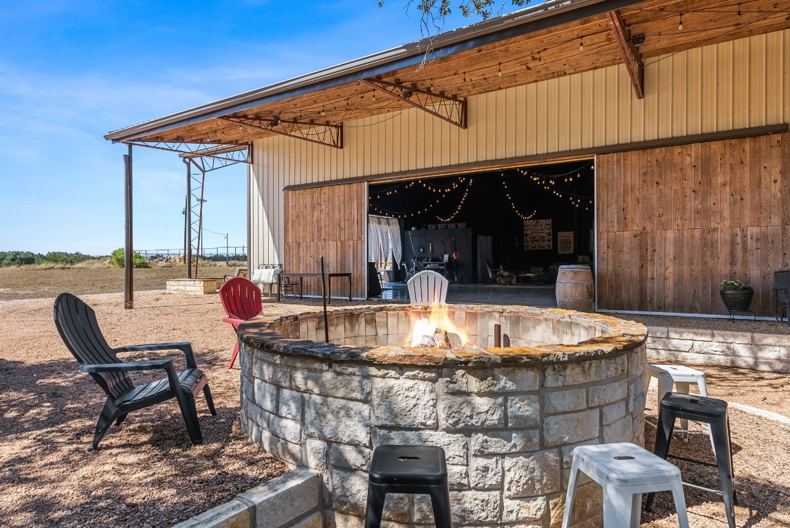 7394 Creek Road Dripping Springs, TX 78620 - Photo 1 of 39 a view of a patio with table and chairs