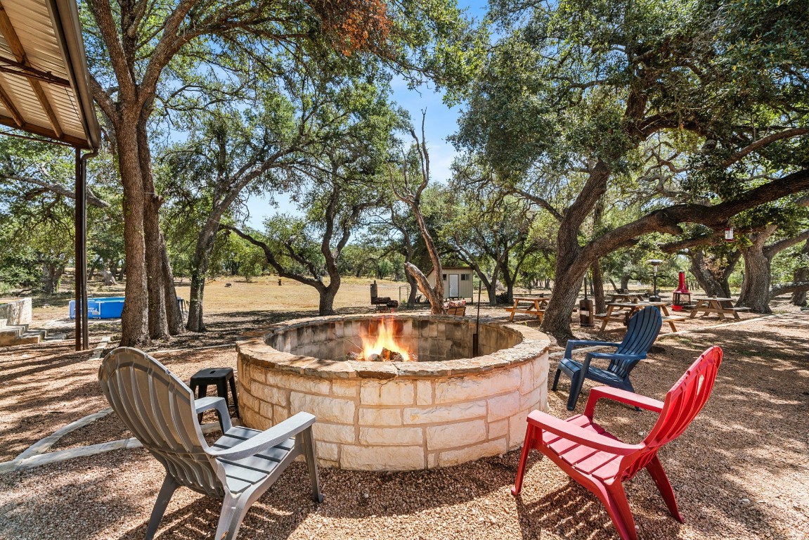 7394 Creek Road Dripping Springs, TX 78620 - Photo 22 of 39 a view of a swimming pool with a patio