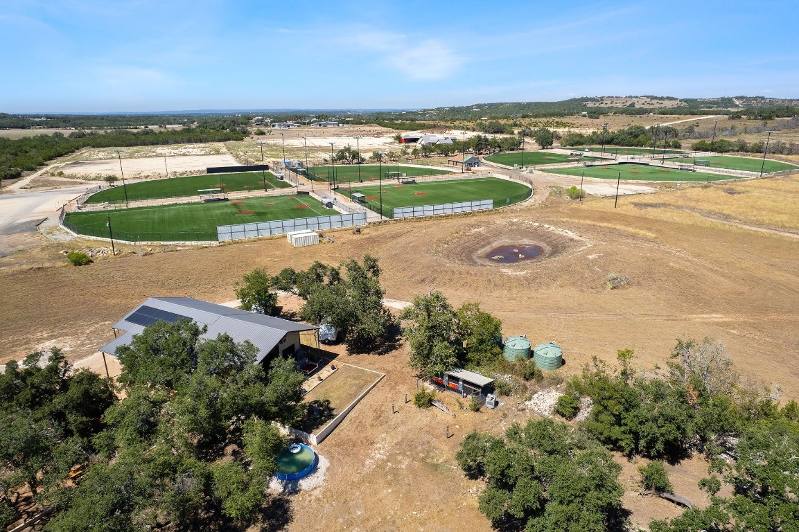 7394 Creek Road Dripping Springs, TX 78620 - Photo 38 of 39 an aerial view of residential houses with outdoor space