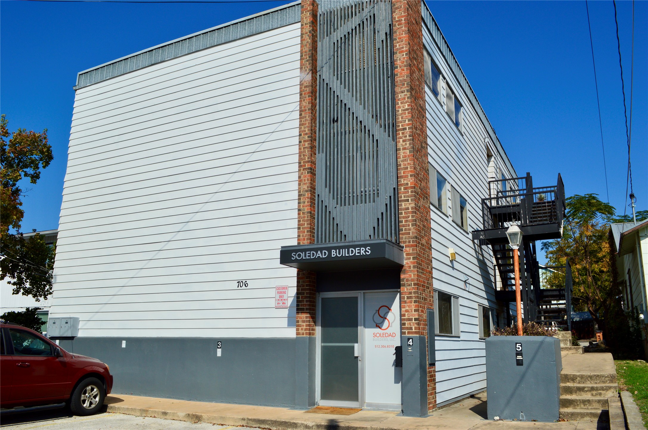 706 West 34th Street, Unit 102 Austin, TX 78705 - Photo 3 of 11 View of building exterior featuring stairs