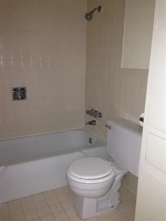 a bathroom with a toilet and shower
