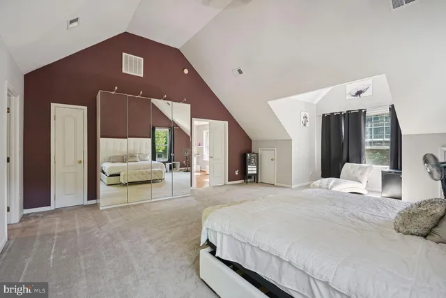 a kitchen with stainless steel appliances granite countertop a stove top oven a sink dishwasher and cabinets with wooden floor