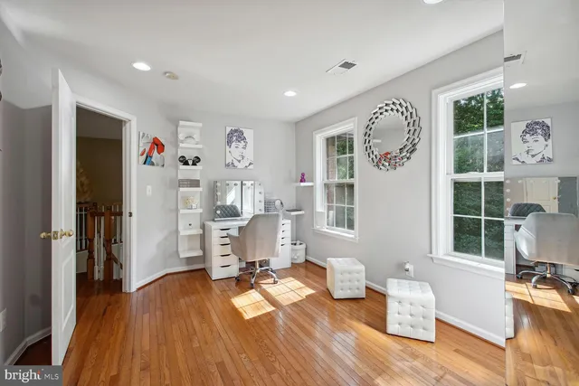 a bathroom with a bathtub sink and mirror