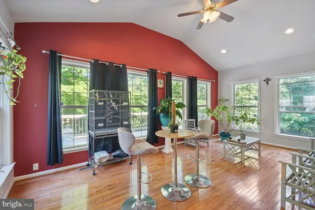 a dining room with furniture and a view of kitchen